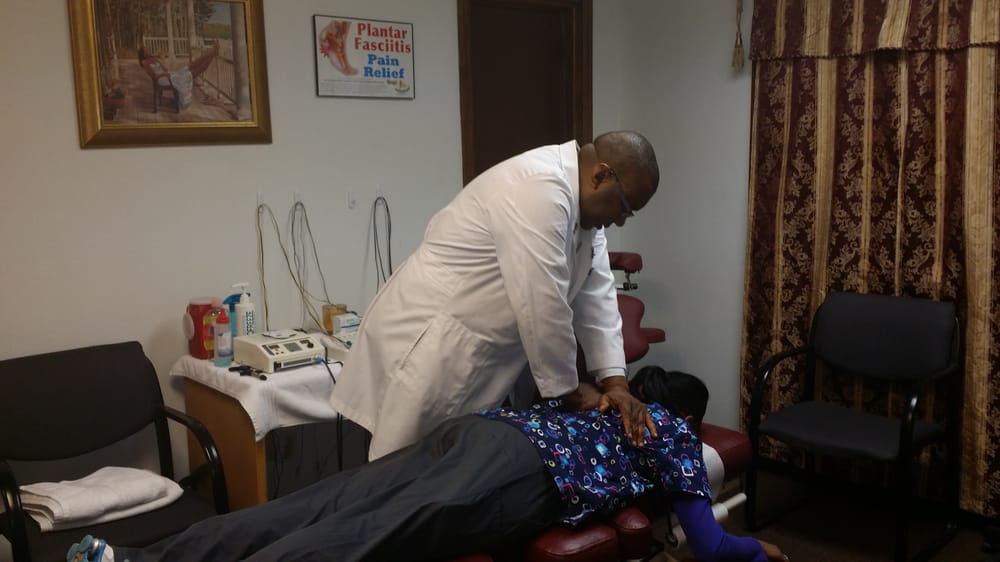 Dr. Chira consulting with a patient